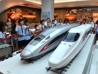 Primary school children are viewing models of the Fuxing and Harmony high-speed trains at Jiaoji Railway Museum in Qingdao, Shandong provinc...