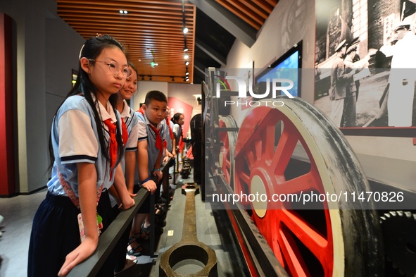 Primary school children are visiting the real wheels of China's first steam locomotive at the Jiaoji Railway Museum in Qingdao, Shandong pro...