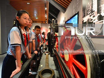 Primary school children are visiting the real wheels of China's first steam locomotive at the Jiaoji Railway Museum in Qingdao, Shandong pro...