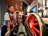 Primary school children are visiting the real wheels of China's first steam locomotive at the Jiaoji Railway Museum in Qingdao, Shandong pro...