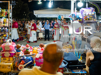 The procession of the Three Saints of Bisceglie is taking place amidst the stalls in Bisceglie, Italy, on August 11, 2024. Bisceglie is cele...