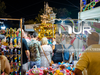 The procession of the Three Saints of Bisceglie is taking place amidst the stalls in Bisceglie, Italy, on August 11, 2024. Bisceglie is cele...