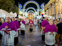 Bishops and priests are participating in the procession of the Three Saints of Bisceglie in the town centre, in Bisceglie, on August 11, 202...