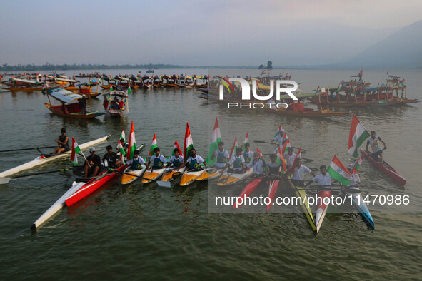 Participants are riding kayaks as they take part in the Tiranga Rally ahead of India's Independence Day celebrations in Srinagar, Jammu and...