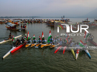 Participants are riding kayaks as they take part in the Tiranga Rally ahead of India's Independence Day celebrations in Srinagar, Jammu and...