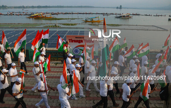 People are taking part in the Tiranga Rally ahead of India's Independence Day celebrations in Srinagar, Jammu and Kashmir, on August 12, 202...