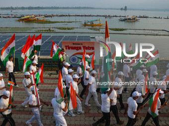 People are taking part in the Tiranga Rally ahead of India's Independence Day celebrations in Srinagar, Jammu and Kashmir, on August 12, 202...