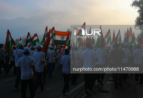 People are taking part in the Tiranga Rally ahead of India's Independence Day celebrations in Srinagar, Jammu and Kashmir, on August 12, 202...