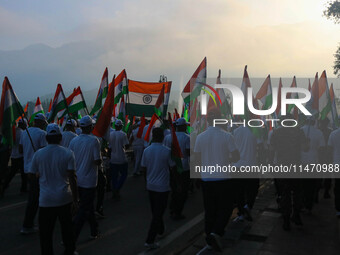 People are taking part in the Tiranga Rally ahead of India's Independence Day celebrations in Srinagar, Jammu and Kashmir, on August 12, 202...