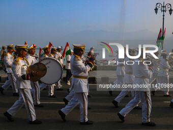 Indian Border Security Force (BSF) band members are performing during the Tiranga Rally ahead of India's Independence Day celebrations in Sr...