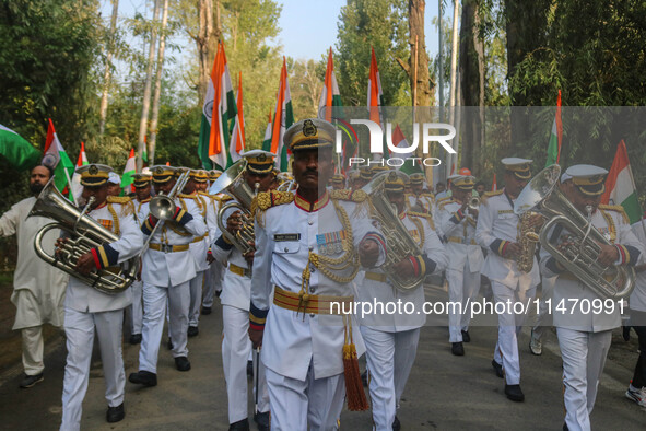 Indian Border Security Force (BSF) band members are performing during the Tiranga Rally ahead of India's Independence Day celebrations in Sr...