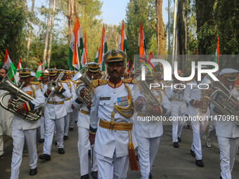 Indian Border Security Force (BSF) band members are performing during the Tiranga Rally ahead of India's Independence Day celebrations in Sr...