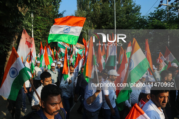 People are taking part in the Tiranga Rally ahead of India's Independence Day celebrations in Srinagar, Jammu and Kashmir, on August 12, 202...