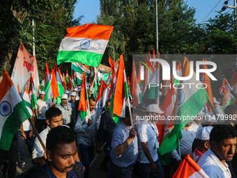 People are taking part in the Tiranga Rally ahead of India's Independence Day celebrations in Srinagar, Jammu and Kashmir, on August 12, 202...