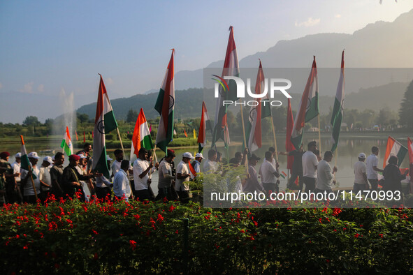 People are taking part in the Tiranga Rally ahead of India's Independence Day celebrations in Srinagar, Jammu and Kashmir, on August 12, 202...