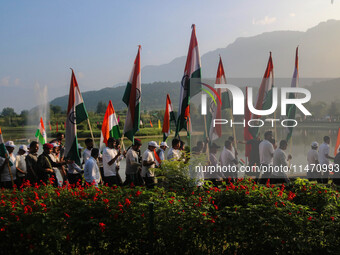 People are taking part in the Tiranga Rally ahead of India's Independence Day celebrations in Srinagar, Jammu and Kashmir, on August 12, 202...