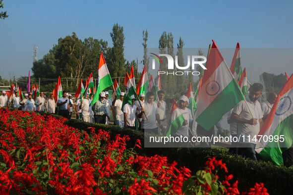 People are taking part in the Tiranga Rally ahead of India's Independence Day celebrations in Srinagar, Jammu and Kashmir, on August 12, 202...