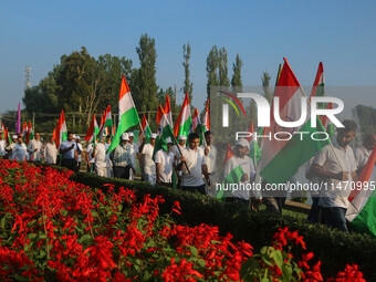 People are taking part in the Tiranga Rally ahead of India's Independence Day celebrations in Srinagar, Jammu and Kashmir, on August 12, 202...