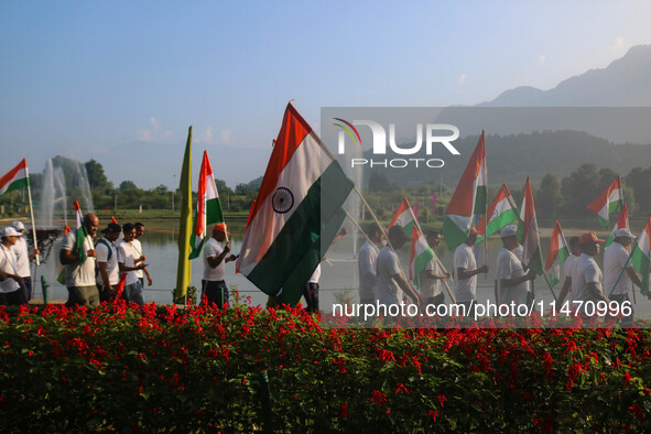 People are taking part in the Tiranga Rally ahead of India's Independence Day celebrations in Srinagar, Jammu and Kashmir, on August 12, 202...