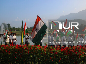 People are taking part in the Tiranga Rally ahead of India's Independence Day celebrations in Srinagar, Jammu and Kashmir, on August 12, 202...