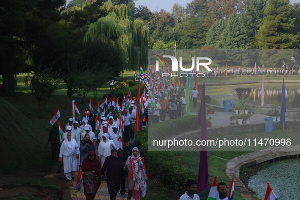 People are taking part in the Tiranga Rally ahead of India's Independence Day celebrations in Srinagar, Jammu and Kashmir, on August 12, 202...