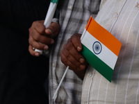 A man is holding the Indian National flag during the Tiranga Rally ahead of India's Independence Day celebrations in Srinagar, Jammu and Kas...