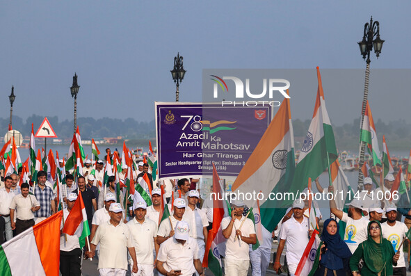 People are taking part in the Tiranga Rally ahead of India's Independence Day celebrations in Srinagar, Jammu and Kashmir, on August 12, 202...