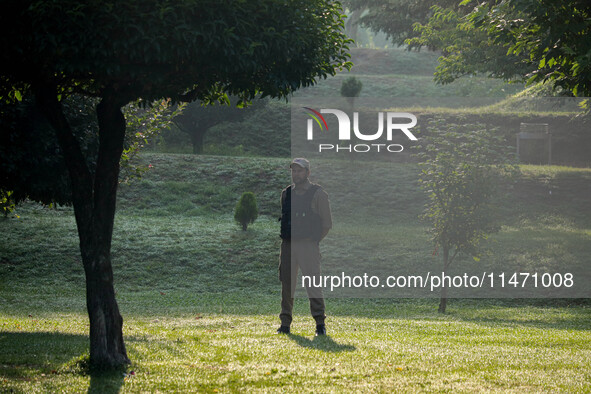 An Indian policeman is standing guard during the Tiranga Rally ahead of India's Independence Day celebrations in Srinagar, Jammu and Kashmir...