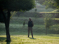 An Indian policeman is standing guard during the Tiranga Rally ahead of India's Independence Day celebrations in Srinagar, Jammu and Kashmir...