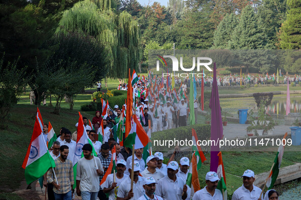 People are taking part in the Tiranga Rally ahead of India's Independence Day celebrations in Srinagar, Jammu and Kashmir, on August 12, 202...