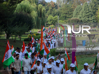 People are taking part in the Tiranga Rally ahead of India's Independence Day celebrations in Srinagar, Jammu and Kashmir, on August 12, 202...