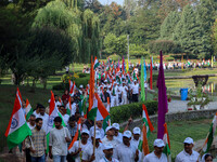 People are taking part in the Tiranga Rally ahead of India's Independence Day celebrations in Srinagar, Jammu and Kashmir, on August 12, 202...