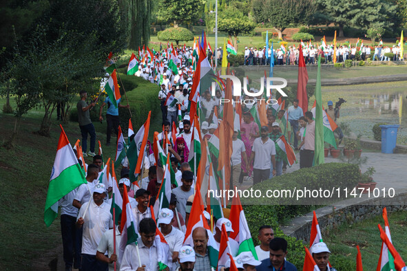 People are taking part in the Tiranga Rally ahead of India's Independence Day celebrations in Srinagar, Jammu and Kashmir, on August 12, 202...