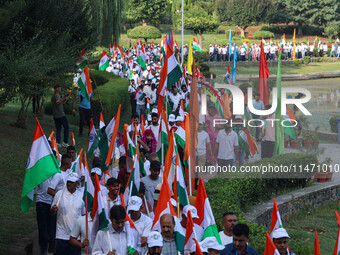 People are taking part in the Tiranga Rally ahead of India's Independence Day celebrations in Srinagar, Jammu and Kashmir, on August 12, 202...