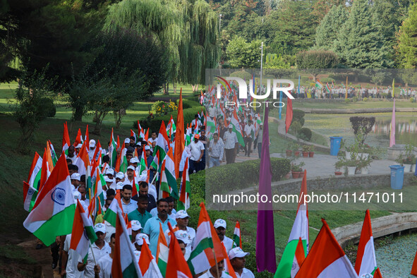 People are taking part in the Tiranga Rally ahead of India's Independence Day celebrations in Srinagar, Jammu and Kashmir, on August 12, 202...