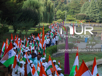 People are taking part in the Tiranga Rally ahead of India's Independence Day celebrations in Srinagar, Jammu and Kashmir, on August 12, 202...