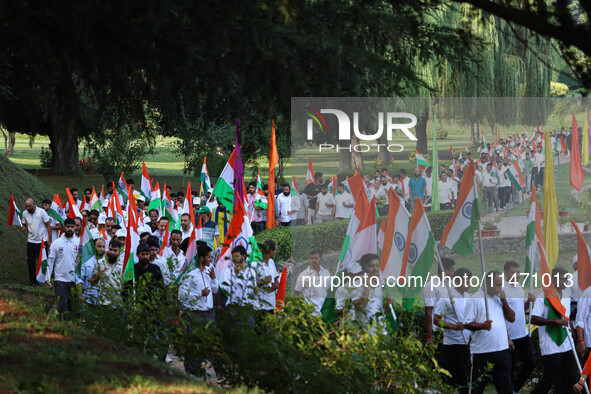 People are taking part in the Tiranga Rally ahead of India's Independence Day celebrations in Srinagar, Jammu and Kashmir, on August 12, 202...