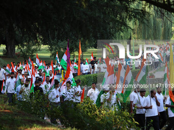 People are taking part in the Tiranga Rally ahead of India's Independence Day celebrations in Srinagar, Jammu and Kashmir, on August 12, 202...