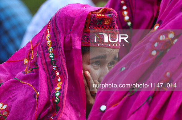 A woman is looking on during the Tiranga Rally ahead of India's Independence Day celebrations in Srinagar, Jammu and Kashmir, on August 12,...