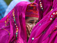 A woman is looking on during the Tiranga Rally ahead of India's Independence Day celebrations in Srinagar, Jammu and Kashmir, on August 12,...