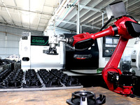 A robot is producing pump products on a production line in Ningde, Fujian province, China, on August 12, 2024. (