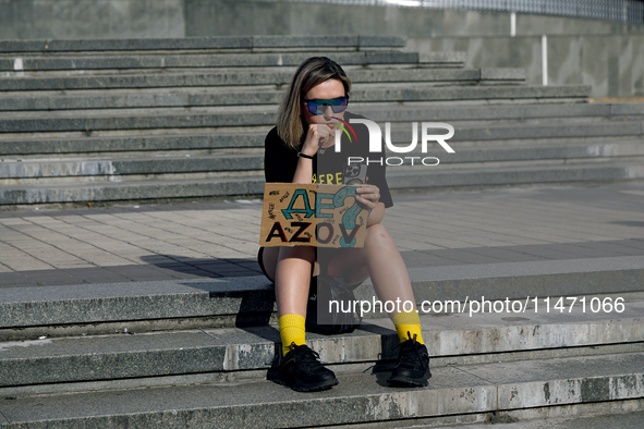 A woman is holding the 'Where Is Azov?' placard during the Don't Be Silent. Captivity Kills! rally in support of Ukrainian prisoners of war...