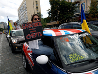 A demonstrator is holding a placard in a car during the Don't Be Silent. Captivity Kills! rally to support Ukrainian prisoners of war of the...