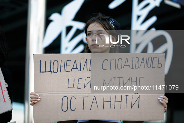 An activist is holding a placard during the Don't Be Silent. Captivity Kills! rally held to support Ukrainian prisoners of war of the Mariup...