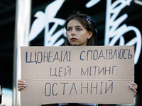 An activist is holding a placard during the Don't Be Silent. Captivity Kills! rally held to support Ukrainian prisoners of war of the Mariup...