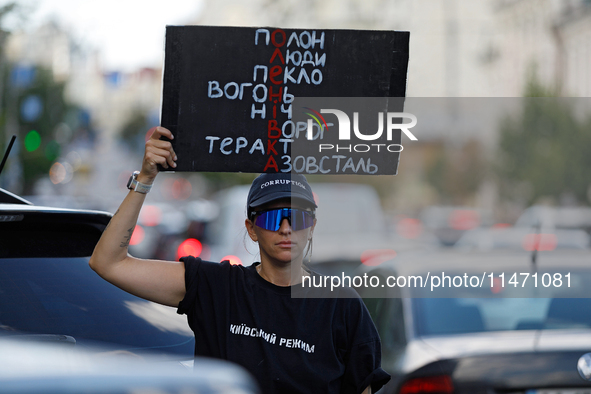 An activist is holding a placard during the Don't Be Silent. Captivity Kills! rally held to support Ukrainian prisoners of war of the Mariup...