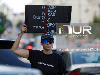 An activist is holding a placard during the Don't Be Silent. Captivity Kills! rally held to support Ukrainian prisoners of war of the Mariup...