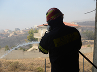 Firefighters are operating during a wildfire in Varnavas, north of Athens, on August 12, 2024. Greece is battling several wildfires on Augus...