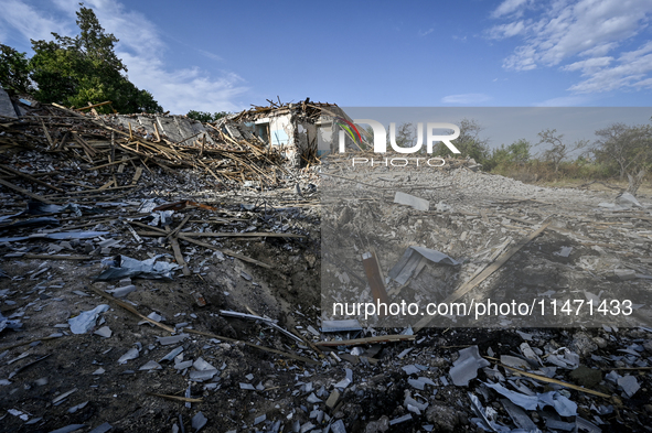 The crater from a Russian FAB-500 bomb, which destroyed the Myrnohrad Infectious Diseases Hospital on July 27, 2024, is being seen in the gr...