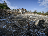 The crater from a Russian FAB-500 bomb, which destroyed the Myrnohrad Infectious Diseases Hospital on July 27, 2024, is being seen in the gr...